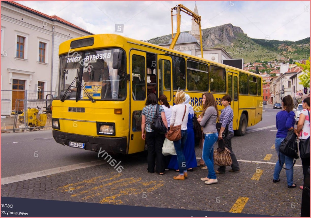 Passengers board a bus in Mostar in Bosnia Herzegovina Stock Photo - Alamy